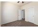 Carpeted bedroom featuring neutral paint and two closet doors at 923 W Wendy Way, Gilbert, AZ 85233