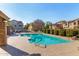 Relaxing community pool with lounge chairs and surrounding well-maintained landscaping at 923 W Wendy Way, Gilbert, AZ 85233