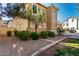 Charming home exterior showcasing desert landscaping, low-maintenance gravel, and healthy green shrubbery at 923 W Wendy Way, Gilbert, AZ 85233