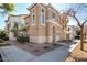 Two-story home featuring desert landscaping, an arched entryway, and sidewalk access at 923 W Wendy Way, Gilbert, AZ 85233