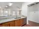 Modern kitchen sink with granite countertops, wood cabinets, and stainless steel dishwasher at 923 W Wendy Way, Gilbert, AZ 85233