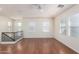 Bright upstairs living room with hardwood floors, large windows, and a ceiling fan at 923 W Wendy Way, Gilbert, AZ 85233