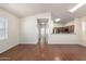 Bright, open-concept living space flows seamlessly into a modern kitchen with hardwood flooring at 923 W Wendy Way, Gilbert, AZ 85233