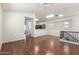 Open-concept living room with hardwood floors and plenty of natural light at 923 W Wendy Way, Gilbert, AZ 85233