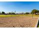 Outdoor volleyball court with net in place, set against a backdrop of lush green fields and sunny skies at 923 W Wendy Way, Gilbert, AZ 85233