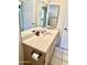 Bathroom featuring a long countertop and cabinet storage for added functionality at 9238 W Behrend Dr, Peoria, AZ 85382