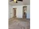 Bright bedroom with doorways leading to other rooms and neutral carpeting at 9238 W Behrend Dr, Peoria, AZ 85382