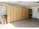 Garage with cabinets, providing ample storage space and organization at 9238 W Behrend Dr, Peoria, AZ 85382