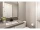 Bathroom featuring a neutral color palette and a modern mirror over the sink at 9716 E Resistance Ave, Mesa, AZ 85212