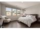 Relaxing main bedroom with a large window, natural light, and stylish contemporary furnishings at 9716 E Resistance Ave, Mesa, AZ 85212