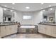 Elegant bathroom featuring dual vanities, a soaking tub, and slate flooring at 9887 E Palo Brea Dr, Scottsdale, AZ 85262