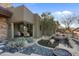 Outdoor living with a serene water feature, lush landscaping, and seamless integration with the surrounding desert environment at 9887 E Palo Brea Dr, Scottsdale, AZ 85262