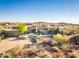 Stunning desert home featuring landscaped grounds, spacious driveway and neutral color palette at 9887 E Palo Brea Dr, Scottsdale, AZ 85262