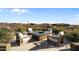 Inviting outdoor firepit area with comfortable seating and panoramic views at 9887 E Palo Brea Dr, Scottsdale, AZ 85262