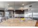 Bright kitchen featuring stainless steel appliances and an island with bar seating at 9887 E Palo Brea Dr, Scottsdale, AZ 85262