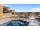 Inviting pool area with desert landscaping, and mountain views at 9887 E Palo Brea Dr, Scottsdale, AZ 85262