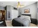 Bedroom with a ceiling fan, neutral carpet, and view of closet at 1013 S Hazel Ct, Gilbert, AZ 85296