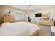 Bright main bedroom features neutral decor, a ceiling fan, and sunny window with plantation shutters at 1013 S Hazel Ct, Gilbert, AZ 85296