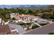 Expansive aerial view of the home showcasing the landscaped front yard and mountain views at 10440 E Larkspur Dr, Scottsdale, AZ 85259