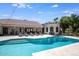 Beautiful pool with a spa and ample deck space, perfect for entertaining at 10440 E Larkspur Dr, Scottsdale, AZ 85259