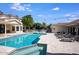 Resort-style pool with a tanning ledge and lush landscaping, perfect for outdoor living at 10440 E Larkspur Dr, Scottsdale, AZ 85259