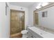 Bathroom featuring a glass shower and sink with a large framed mirror at 10611 N 9Th Dr, Phoenix, AZ 85029