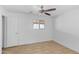 A neutral bedroom features a ceiling fan and a window at 10611 N 9Th Dr, Phoenix, AZ 85029