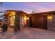 Close up of the exterior featuring desert landscaping, a patterned garage door, and stone accents at 10611 N 9Th Dr, Phoenix, AZ 85029