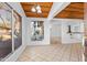 Bright living room with wood ceilings, decorative windows, and an open floor plan at 10611 N 9Th Dr, Phoenix, AZ 85029