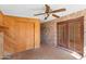 Sunroom with brick floors, brick wall, and wooden cabinets at 10611 N 9Th Dr, Phoenix, AZ 85029