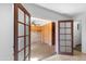 Sunroom with brick floor, ceiling fan, and wood paneled wall at 10611 N 9Th Dr, Phoenix, AZ 85029