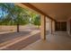 Covered patio overlooking the backyard, perfect for outdoor living and entertaining at 10901 E Sunnydale Dr, Sun Lakes, AZ 85248