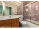 A pink bathroom featuring a tub, shower, and vanity at 10901 E Sunnydale Dr, Sun Lakes, AZ 85248