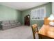 Bedroom featuring a green wall, carpet, and furniture at 10901 E Sunnydale Dr, Sun Lakes, AZ 85248