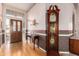 Elegant foyer featuring hardwood floors, a grandfather clock, and traditional décor, creating a warm welcome at 10901 E Sunnydale Dr, Sun Lakes, AZ 85248