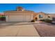 Charming single-story home featuring a terracotta roof, and a spacious three-car garage and easy-to-maintain landscaping at 10901 E Sunnydale Dr, Sun Lakes, AZ 85248