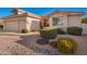 Charming single-story home featuring a terracotta roof and well-maintained desert landscaping, including river rock at 10901 E Sunnydale Dr, Sun Lakes, AZ 85248