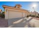 Home featuring a terracotta roof, and a spacious three-car garage and is enhanced by the bright sunlight at 10901 E Sunnydale Dr, Sun Lakes, AZ 85248