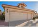 Home featuring a terracotta roof, and a spacious three-car garage with a large concrete driveway at 10901 E Sunnydale Dr, Sun Lakes, AZ 85248