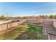 Spacious fenced backyard featuring mature trees and green grass at 1119 W Heather Ave, Gilbert, AZ 85233