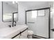 This bright bathroom features a white vanity, and a glass shower door at 1119 W Heather Ave, Gilbert, AZ 85233