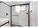 Modern bathroom featuring subway tile shower with sliding glass doors at 1119 W Heather Ave, Gilbert, AZ 85233