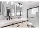 This bathroom includes dual sinks, sliding glass door, and neutral colors at 1119 W Heather Ave, Gilbert, AZ 85233