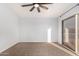 Bedroom with a ceiling fan and sliding glass door to a private balcony at 1119 W Heather Ave, Gilbert, AZ 85233