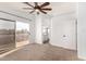 Bedroom with private balcony access, ensuite bath, and ceiling fan at 1119 W Heather Ave, Gilbert, AZ 85233