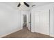 This bedroom has a ceiling fan and a closet for storage at 1119 W Heather Ave, Gilbert, AZ 85233