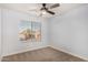 This bedroom features a window with blinds and neutral carpet at 1119 W Heather Ave, Gilbert, AZ 85233