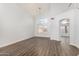 Bright dining room featuring high ceilings, hardwood floors, and a modern chandelier at 1119 W Heather Ave, Gilbert, AZ 85233