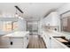 Modern kitchen with white cabinets, center island, stainless steel appliances and a view of the backyard at 1119 W Heather Ave, Gilbert, AZ 85233