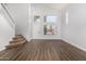 Bright living room featuring high ceilings, hardwood floors, a staircase, and large windows at 1119 W Heather Ave, Gilbert, AZ 85233